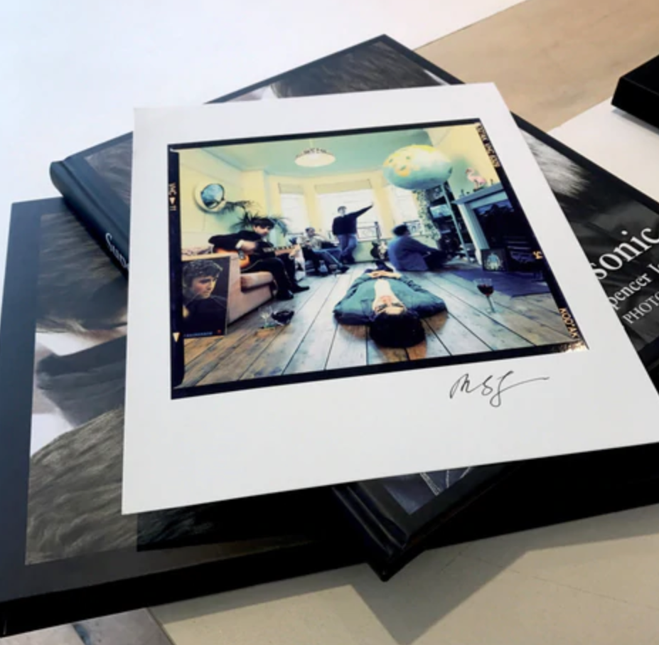 Pictured is the print of Oasis's album 'Definitely Maybe'.