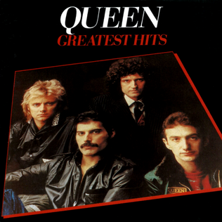All four members of queen sat together with "queen Greatest hits" above them