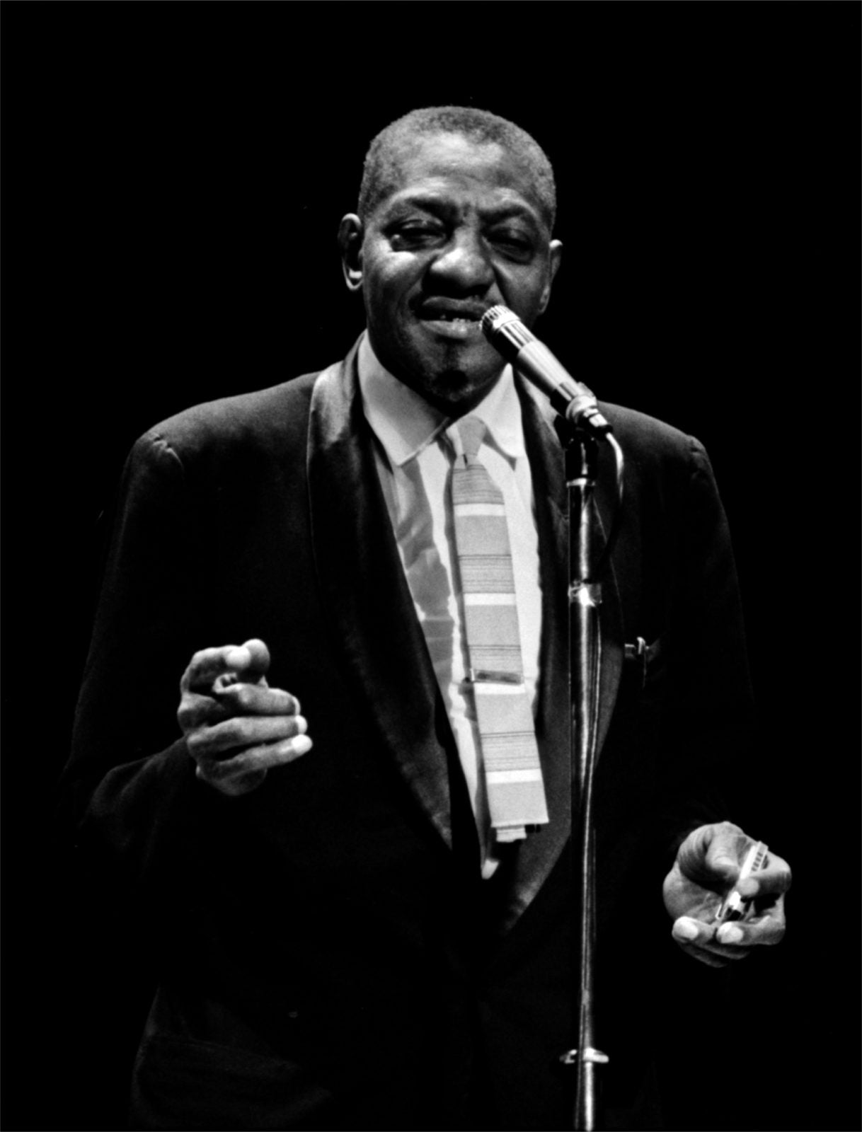 Sonny Boy Williamson half way through singing with his hands floating 