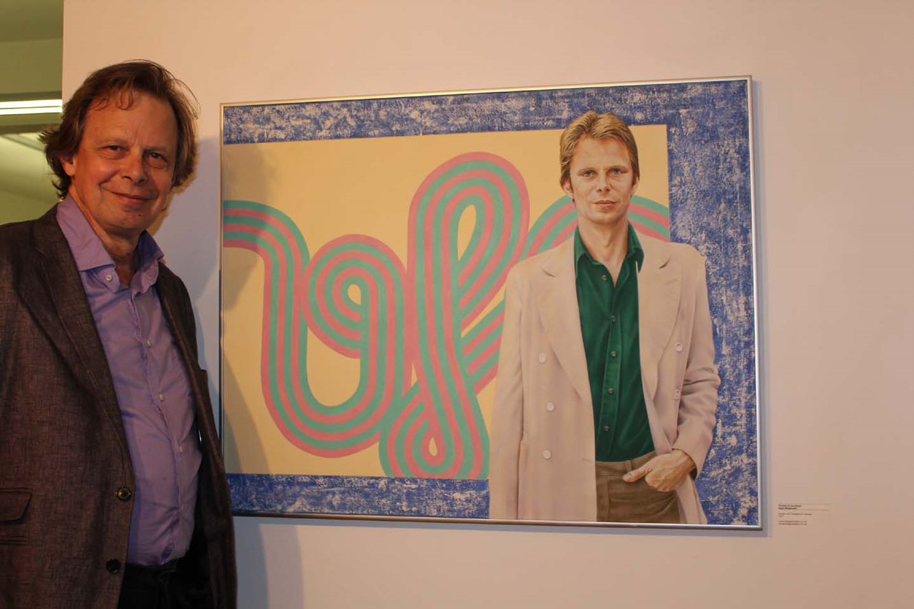 Nigel Waymouth standing by one of his works of art